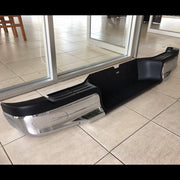 Hilux rear bumper with integrated step
